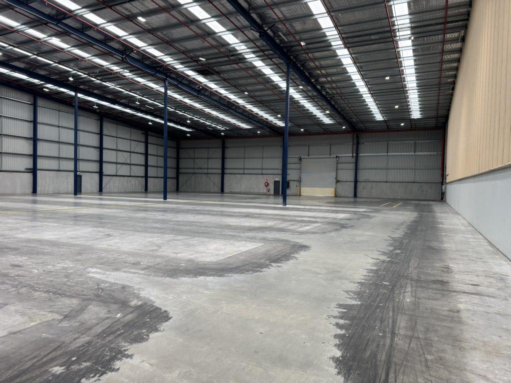 Cleared warehouse interior ready for handover following end-of-lease make good, Lawrence & Hanson project